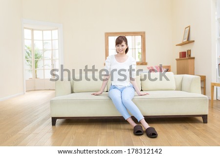 Beautiful asian woman relaxing in the room