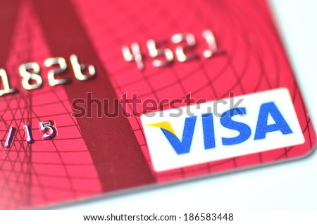 KWIDZYN, POLAND - APRIL 10, 2014: Closeup of VISA credit card isolated on white background. VISA is one of the three biggest brands. First VISA card was issued in 1958