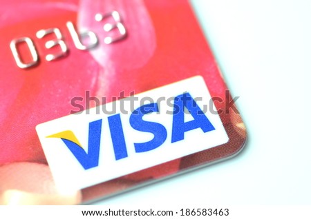 KWIDZYN, POLAND - APRIL 10, 2014: Closeup of VISA credit card isolated on white background. VISA is one of the three biggest brands. First VISA card was issued in 1958