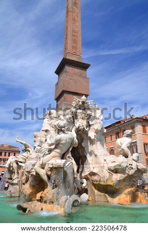 ROME, ITALY - AUGUST 21, 2014: Beautiful Fountain of the Four Rivers on Piazza Navona in Rome, Italy. The fountain was sculpted by Gian Lorenzo Bernini in 1651.