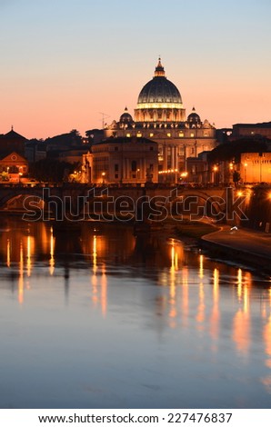 ROME, ITALY -AUGUST 22, 2014: Monumental St. Peters Basilica over Tiber at sunset in Rome, Italy. St. Peters Basilica is papal late renaissance basilica consecrated in 1626.