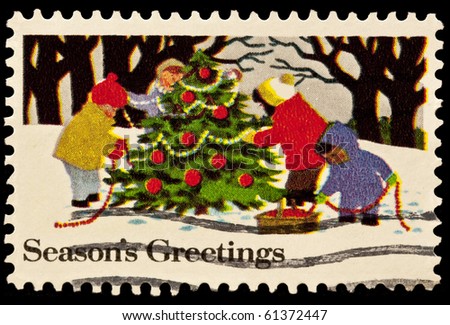 UNITED STATES - CIRCA 1980\'s : A stamp printed in United States. Kids decorating Christmas tree. United States - CIRCA 1980\'s