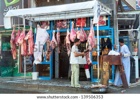 HURGHADA, EGYPT - APR 07:  Unidentified local people working in butcher\'s shop in Hurghada on 07 April 2013. Butcher\'s shop is one of the local shops on the street in Hurhgada, Egypt.