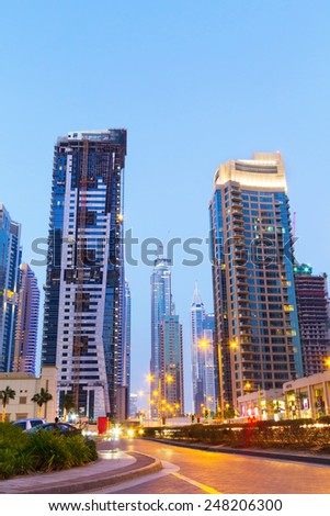 DUBAI, UAE - MARCH 30: Traffic on the streets of Dubai Marina on March 30, 2014, UAE. Dubai Marina is a district in Dubai with artificial canal skyscrapers who accommodates more than 120,000 people.