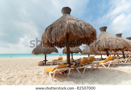 Relaxation under parasol at Caribbean Sea