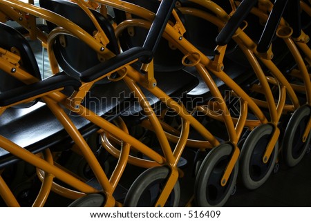 Some airport wheelchairs in a row