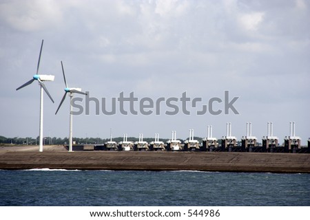 Two windmills and the oosterscheldekering in Zeeland, Netherlands