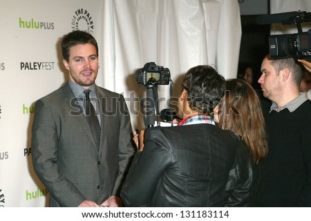 BEVERLY HILLS - MARCH 9: Stephen Amell in interviewed by the media at the 2013 Paleyfest 
