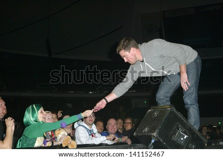 ANAHEIM, CA - MARCH 31: Stephen Amell greets fans after a panel discussion at the 2013 Wondercon convention on March 31, 2013 in Anaheim, CA.