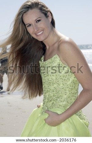 Green evening gown on the beach