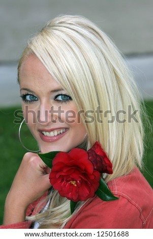 Blond female model with red flower