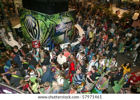 SAN DIEGO, CA - JULY 21: Comic Con attendees mob the Warner Brothers booth on the convention floor July 21, 2010 at the 2010 Comic Con International held in San Diego, CA.