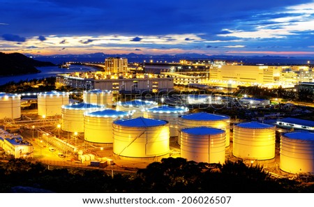 oil tank in power station , sunset