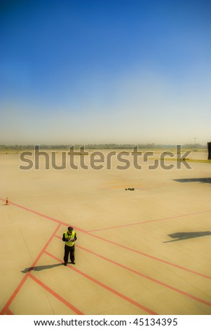 It is airport worker stand alone in airport