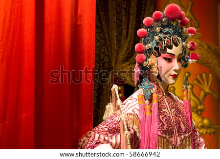 chinese opera dummy and red cloth as text space ,it is a toy,not real man