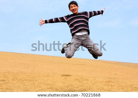 Happy jumping man on winter day