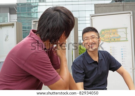 two asia man chatting outdoor