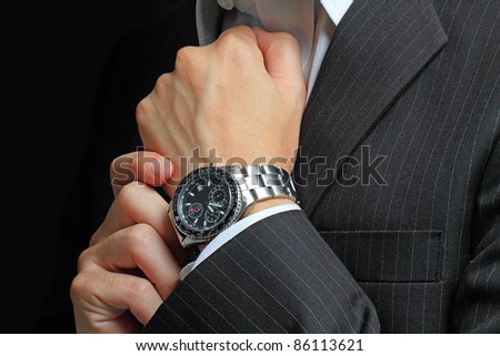 men\'s hand with a watch.