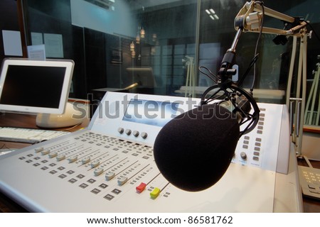 mic in front of the control panel in broadcasting studio