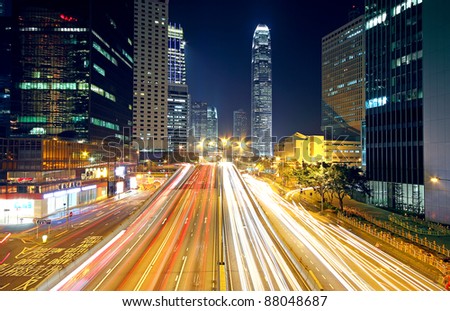Colorful city night with lights of cars motion blurred in hong kong