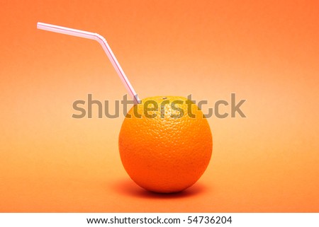 An orange with a straw to depict a fresh orange juice drink.