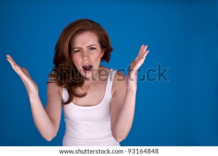 Young attractive woman making her emotions clear that she is angry. Angry woman.