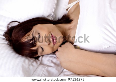 A beautiful woman is in her bed sleeping for the night. Sleeping beauty.