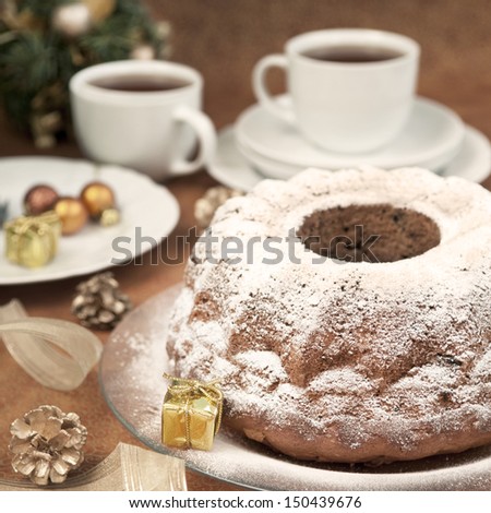 Christmas table setting - cake and christmas decorations, square image, retro style