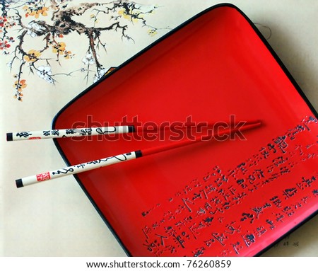 Traditional Japanese red dish and chopsticks
