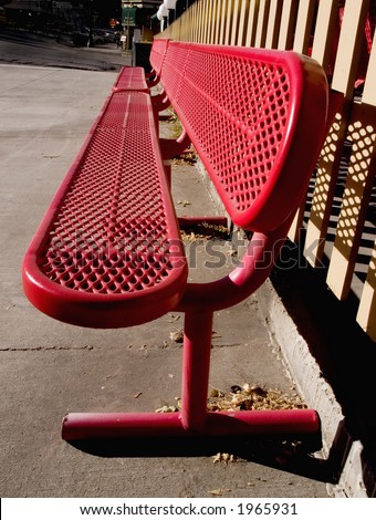 Red metal bench