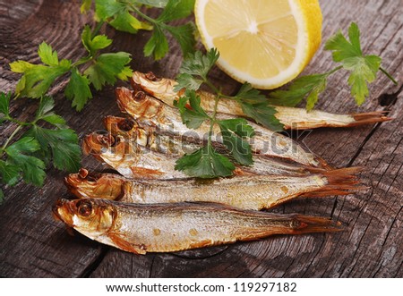 Smoked fishes with herbs