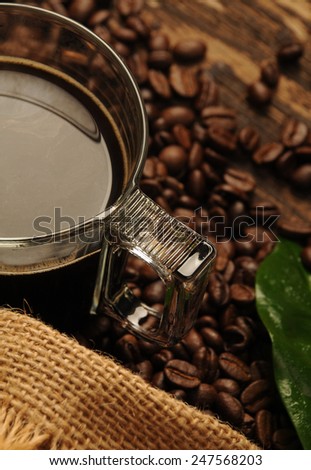Glass of coffee and coffee beans