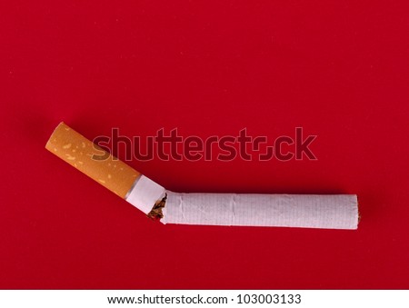 Break the smoking habit - cigarette on textured red background