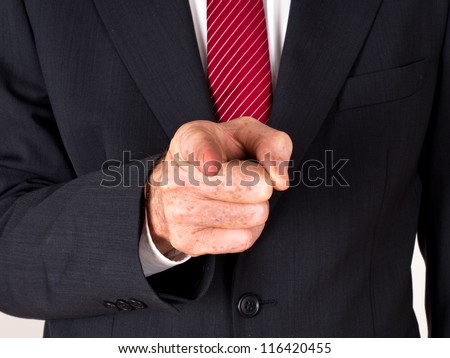 Man in suit pointing - boss, bossy,instructing, differential focus