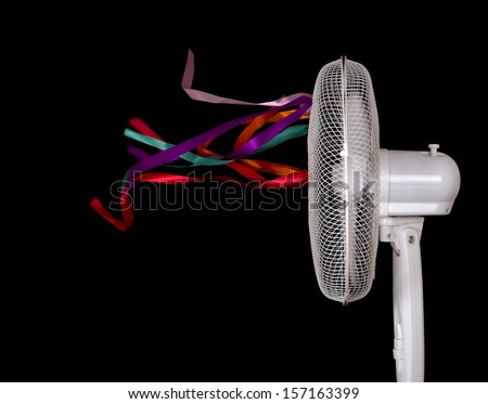 Real ribbons in movement- vertical ventilator, fan over black.