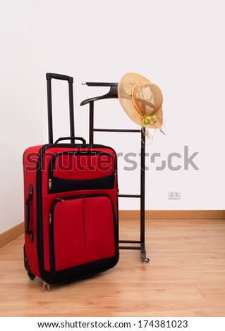 Start of summer holiday, vacation - suit, hotel style clothes rack and sunhat