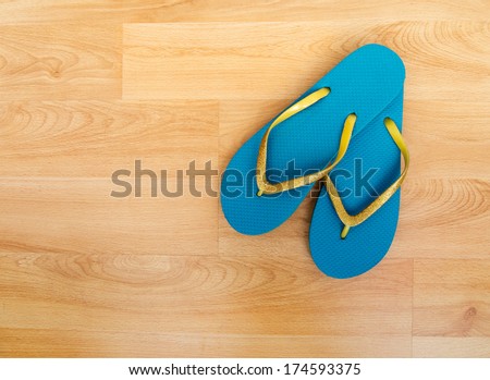 Pretty turquoise and gold glitter flip flops, plastic beach shoes.