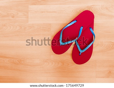 Summer footwear - red and blue glittery flip-flops, plastic beach shoes