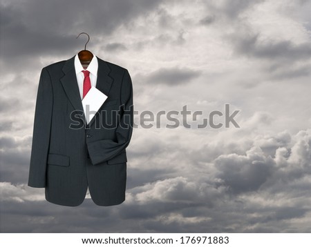 Grey business suit with letter, will or testament, Funeral director maybe - or just job interview preparation etc.