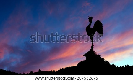 Stunning red sky with cockerel weathervane. New dawn..