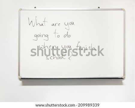 Real handwriting on classroom whiteboard - future career plan.