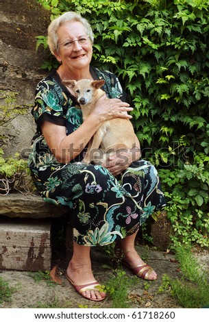 Elderly woman with pet dog