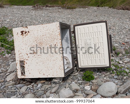 Abandoned dangerous old freezer - environmental damage, rubbish disposal concept