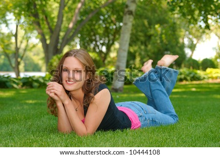 stock photo barefoot teen in lawn