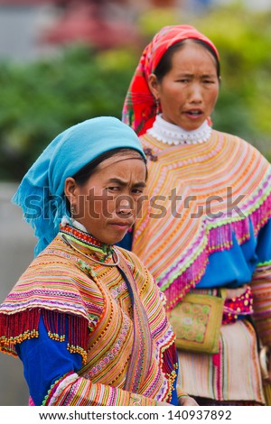 BAC HA, VIETNAM - SEPTEMBER 29: Unidentified women of the Flower H'mong ethnic minority People at market on September 29 2012 in Bac Ha, Vietnam. There are about 800,000 thousand H'mongs in Vietnam.