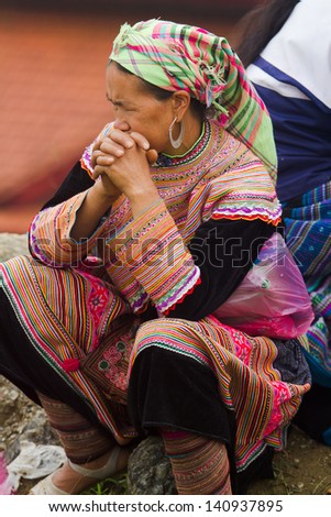 BAC HA, VIETNAM - SEPTEMBER 29: Unidentified women of the Flower H\'mong ethnic minority People at market on September 29 2012 in Bac Ha, Vietnam. There are about 800,000 thousand H\'mongs in Vietnam.