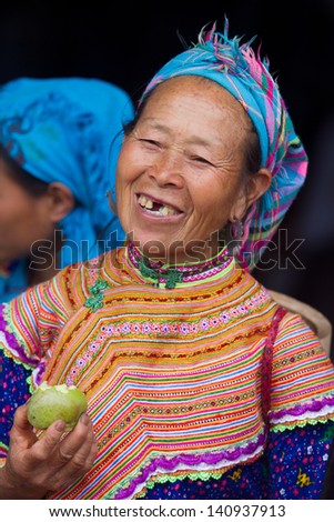 BAC HA, VIETNAM - SEPTEMBER 29: Unidentified women of the Flower H\'mong ethnic minority People at market on September 29 2012 in Bac Ha, Vietnam. There are about 800,000 thousand H\'mongs in Vietnam.