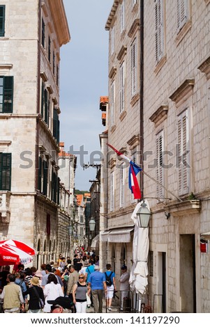 DUBROVNIK, CROATIA - MAY 13: Unidentified people walk along one of many streets on MAY 13,2013 in Dubrovnik. Croatia. Dubrovnik is one of the World Heritage Sites and very popular amongst tourists.