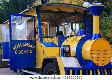 WISLA, POLAND - OCTOBER 13: A road train in Wisla, Poland on October 12, 2013. Train is waiting for passengers while visiting some tourist attraction.