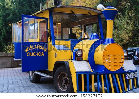 WISLA, POLAND - OCTOBER 13: A road train in Wisla, Poland on October 12, 2013. Train is waiting for passengers while visiting some tourist attraction.